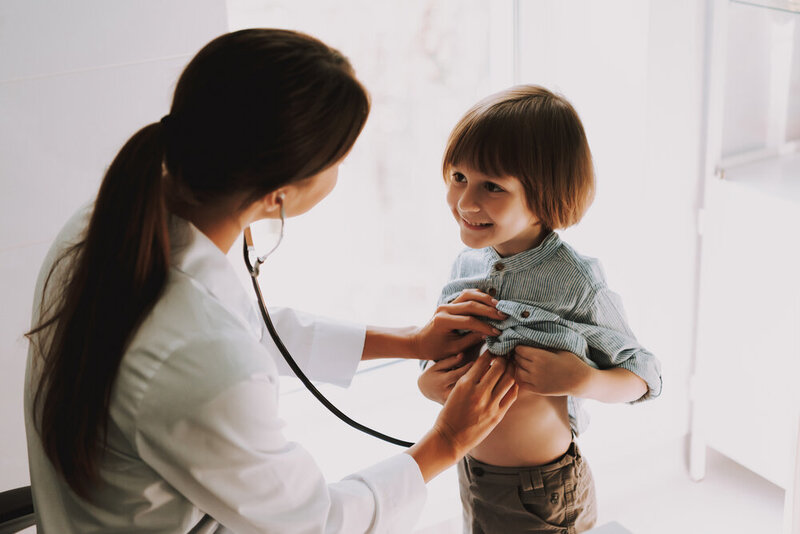 Doctor Listening to Kids Chest with Stethoscope.